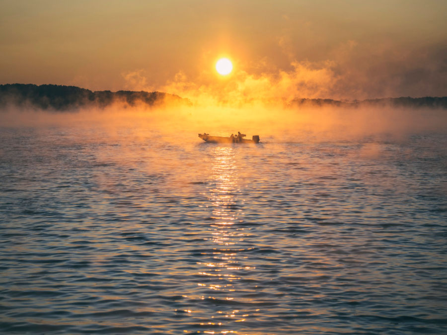 Fishing boat at sunrise.